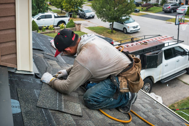 Professional Storm Damage Roof Repair technician working in Westover, PA